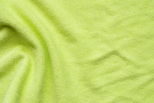 istock Green towel fabric texture surface close up background 1225469626