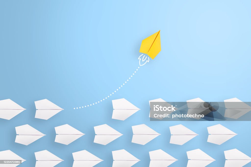 Change concepts with yellow paper airplane leading among white Growth Stock Photo
