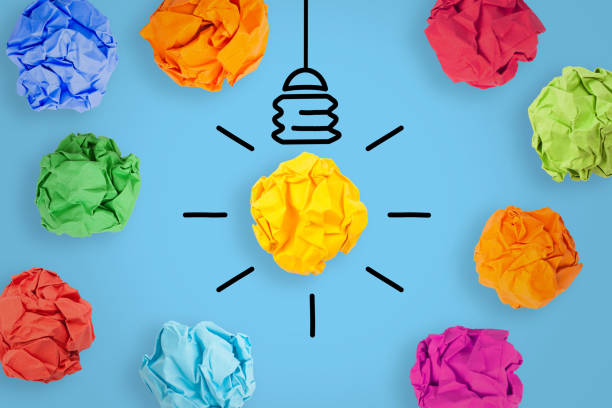 istock Creative Idea Concepts with Light Bulb Crumpled Paper on Blue Background 1225472648