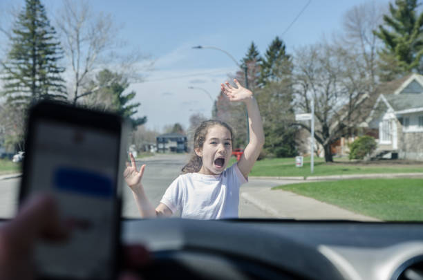 istock Little girl screaming before being hit by car 1225472803