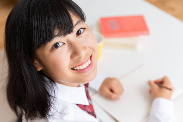 girl in a uniform who study asian girl in a uniform who study high school student photos stock pictures, royalty-free photos & images