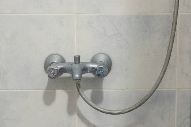 A rusty and chalky tap. Lime water effect.