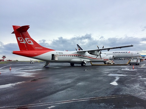 Tahiti, French Polynesia-November 10, 2017: An ATR regional whirlpool plane parked in the apron of Tahiti International Airport, waiting the pessenger to get on board.