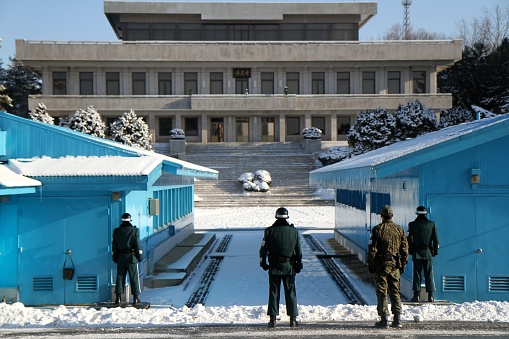 Panmunjom, South Korea - December 13th, 2013: South Korean soldiers routinely guarding border between North and South Korea at the Demilitarized Zone at Panmunjom. Photo Taken during Winter.