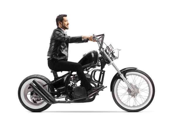 istock Young man in leather jacket riding a chopper motorbike 1225484534