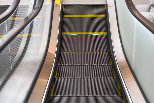 istock two escalators in the mall and business area, bright background 1225487699