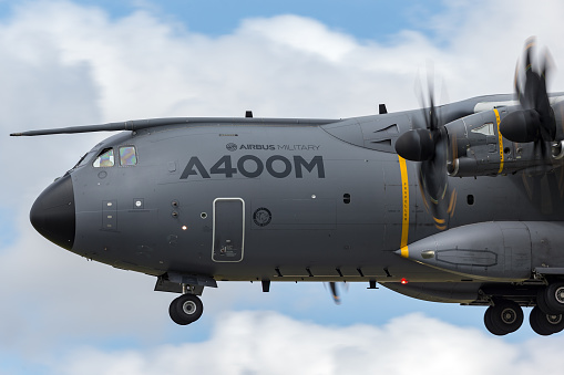 RAF Fairford, Gloucestershire, UK - July 12, 2014: Airbus Military (Airbus Defense and Space) A400M Atlas four engined large military transport aircraft F-WWMZ on approach to land at RAF Fairford, Gloucestershire.
