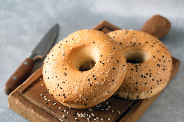 istock Sesame bagels on wooden board 1225491347