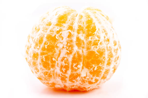 istock whole peeled tangerine closeup isolated on a white background. 1225495551