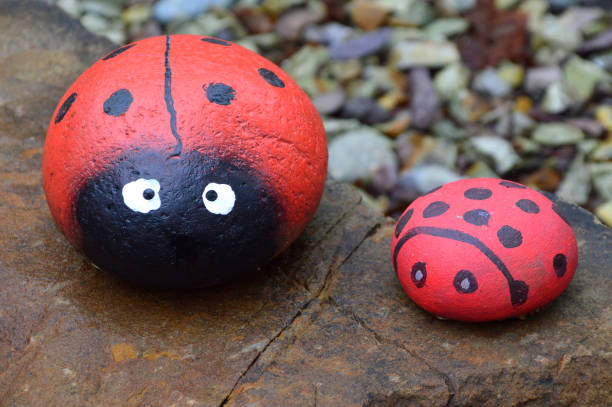 istock Sea ​​stones painted like a ladybug. Decorations for a garden. 1225496505