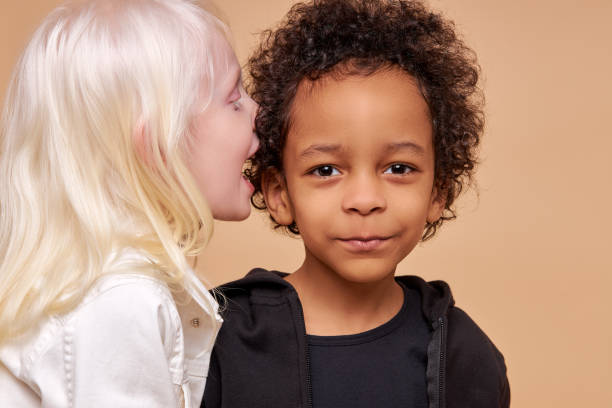 istock friendly diverse children play, tell stories and secrets to each other 1225497609