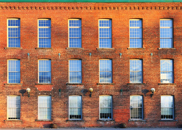 istock Red-Brick Victorian Commercial Building Facade with Windows 1225500093