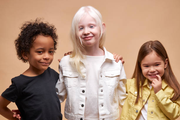 istock diverse smiling positive children posing at camera 1225500921