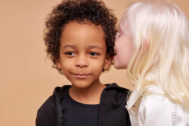 istock sweet children have secret isolated in studio 1225500982