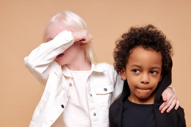 istock black afro and albino kids at a loss 1225501003