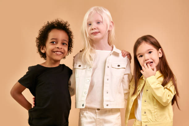 istock diverse smiling positive children posing at camera 1225501027