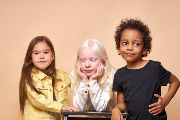 istock three shy and calm diverse kids isolated 1225501169