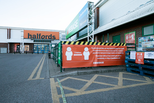 Outside Homebase shopping store in Otford near Sevenoaks, signs guide customers how to queue during the Covid-19 crisis