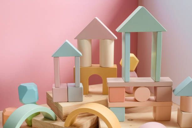 A town made of elements of a wooden children's designer of pastel colors. A town made of elements of a wooden children's designer of pastel colors. The idea of architecture, urban environment, creativity, sustainable design, eco-friendly lifestyle. green building blocks stock pictures, royalty-free photos & images