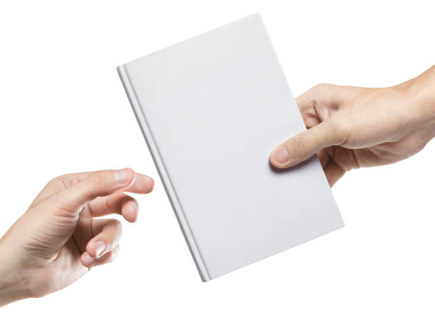 Hands sharing blank book on white Hands sharing blank book, isolated on white background publisher photos stock pictures, royalty-free photos & images