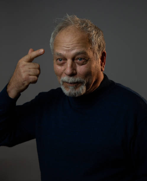 istock happy old man with grey beard and hair smiles cheerfully 1225512245