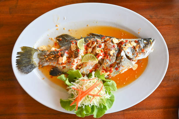 istock Steamed fish with lime - Thai food 1225513284
