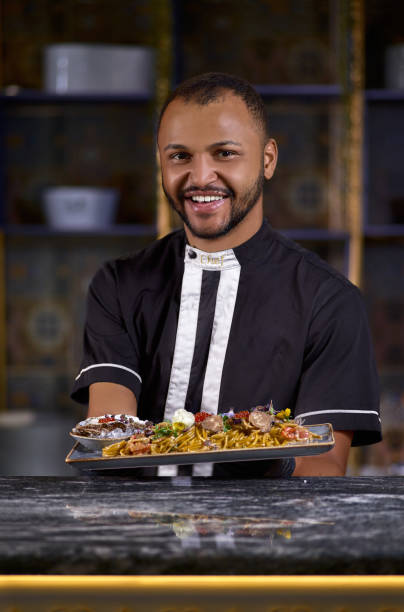 istock happy male chef presenting the dish in commercial kitchen 1225517997