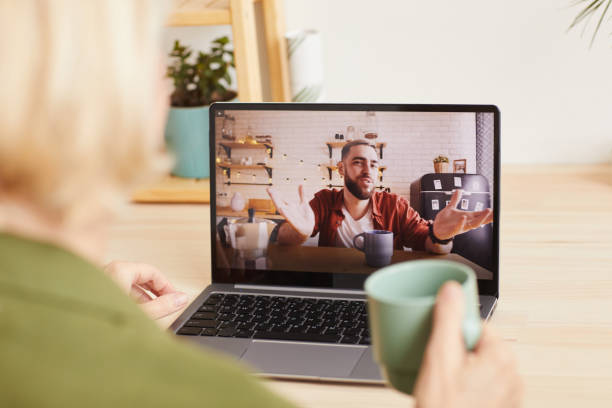 istock Man talking online to woman 1225520136