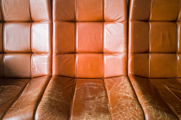 old vintage brown leather armchairs. cracked and worn skin from frequent use - armchair sofa leather brown imagens e fotografias de stock