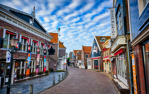 Volendam,the Netherlands Volendam is in North Holland, near Amsterdam. The famous tourist street in Volendam with souvenir shops, cafes and fish restaurants. Volendam is a historic fishing village on the IJsselmeer in North Holland. These photos of the empty streets were taken during the pandemic in the spring of 2020