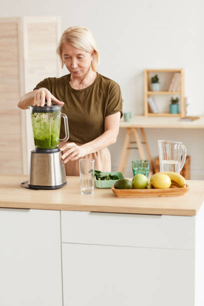 istock Woman making cocktail from vegetable 1225522757