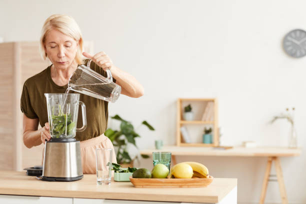 istock Woman preparing cocktail 1225522838