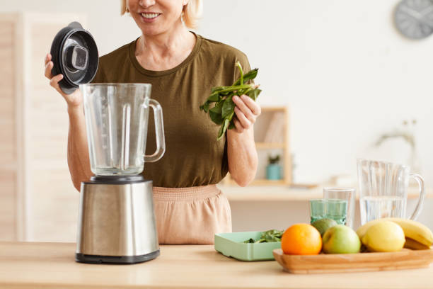 istock Making cocktail from fruits and spinach 1225522847