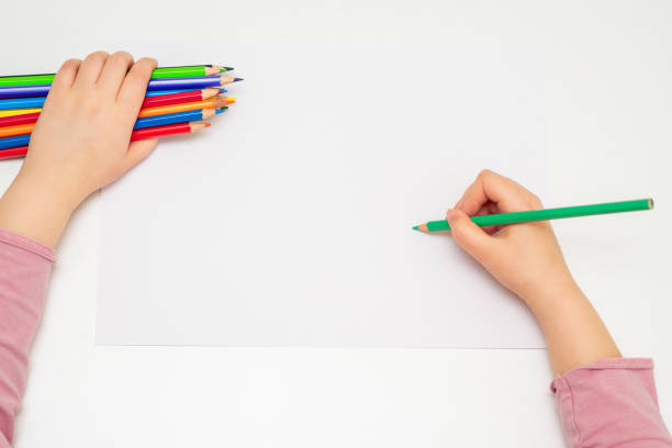 istock Child is drawing by colored pencils. 1225524095