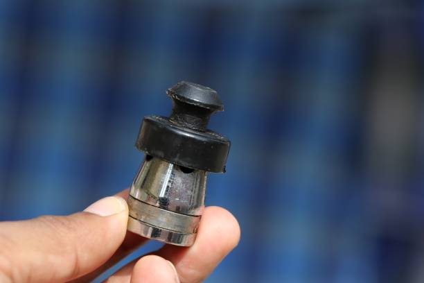 istock Pressure cooker whistle held in hand close up shot 1225524262