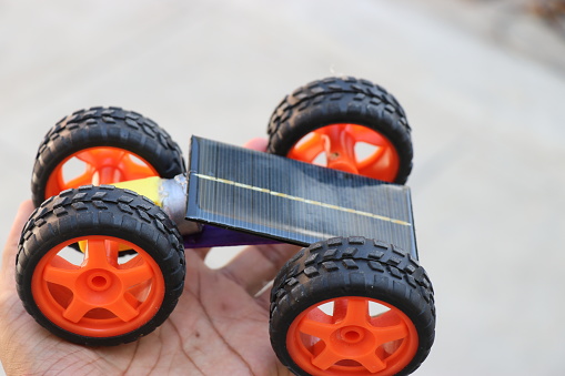Solar powered toy car with big wheels