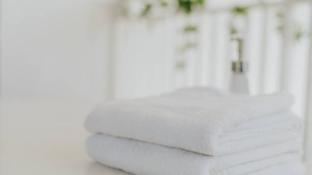 istock Shampoo and shower cream bottle with towel 1225527827