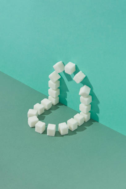 istock Corner geometric composition from sweet refined sugar cubes. 1225531083