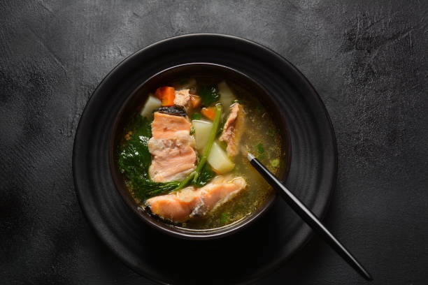 istock Fresh fish soup on black background 1225531524