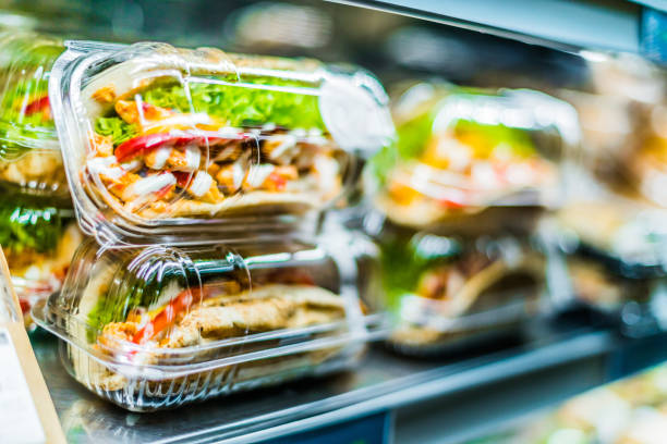 Chicken with pita sandwiches in a commercial refrigerator Chilli chicken with pita, pre-packaged sandwiches displayed in a commercial refrigerator convenience food stock pictures, royalty-free photos & images