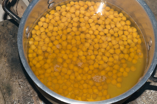 Fresh boiled chick peas in water in a bowl, ready to eat.Chick peas are called choalay and channa in local language of Pakistan and India.