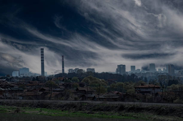 Conceptual image of dramatic dark stormy sky above a concrete city