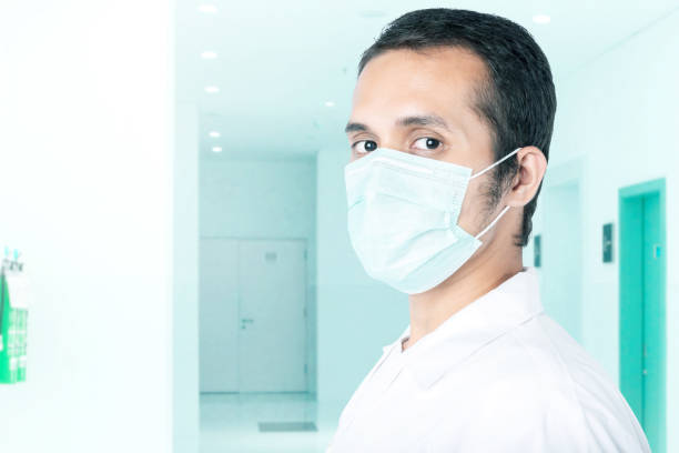 istock Asian man wearing a flu mask 1225536783
