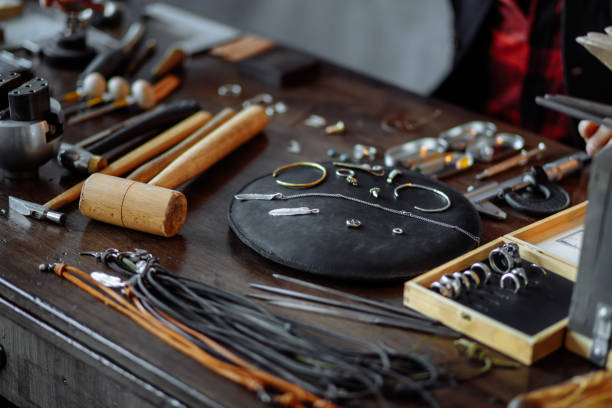 istock messy jeweler's table. useful tools for repairing materials 1225536898