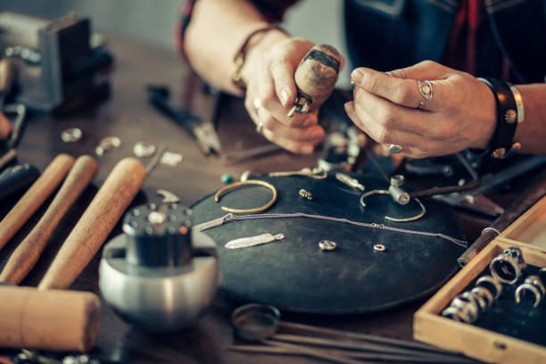 istock craftsman cleans and polishes metal items 1225537256