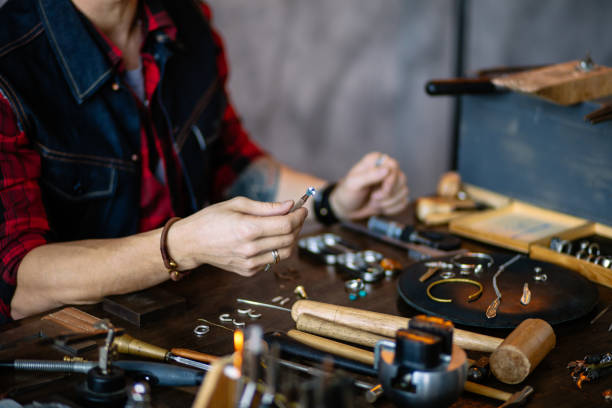 istock Professional jeweler sitting at workplace 1225537296