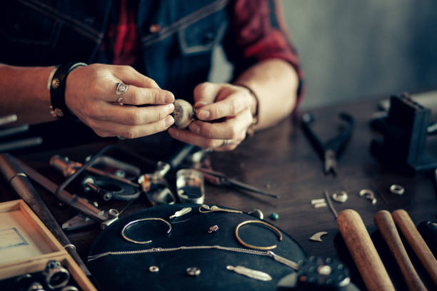 istock man's hands shapingthe pieces of metal 1225537636