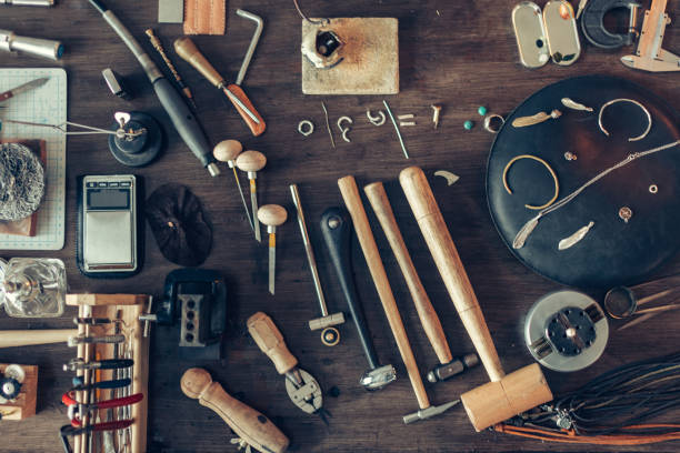 istock table is full of tools for making, repairing adornmnet 1225538264