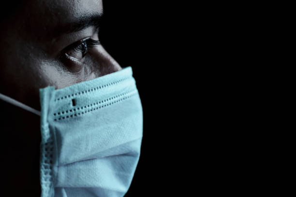 istock Man wearing medical face mask 1225540120