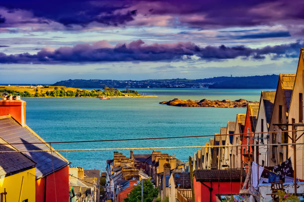 Picturesque town of Cobh at sunset in Ireland, traditional houses with view to Cork Harbour